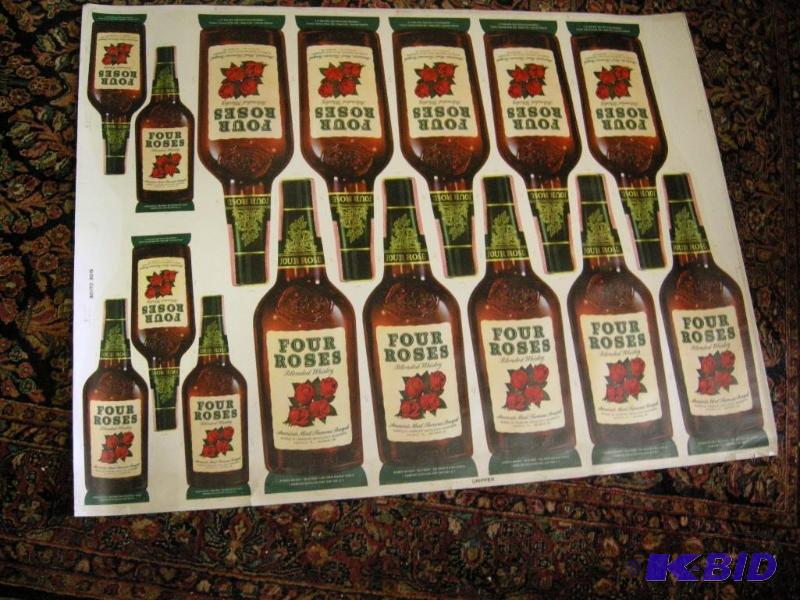 lot 403 image: Four Roses whiskey uncut sheet of bottles