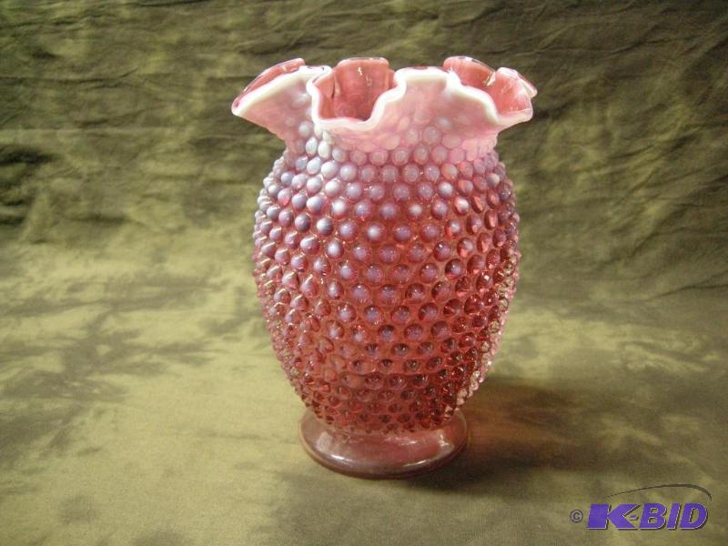 lot 43 image: Cranberry opalescent hobnail vase