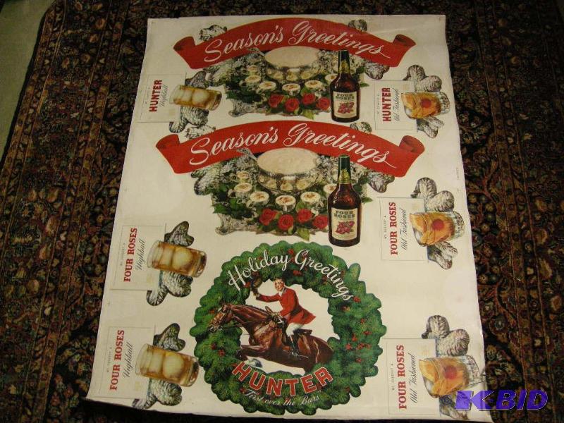 lot 555 image: Vintage Hunter and Four Roses Whiskey Holiday Greetings uncut store display sheet