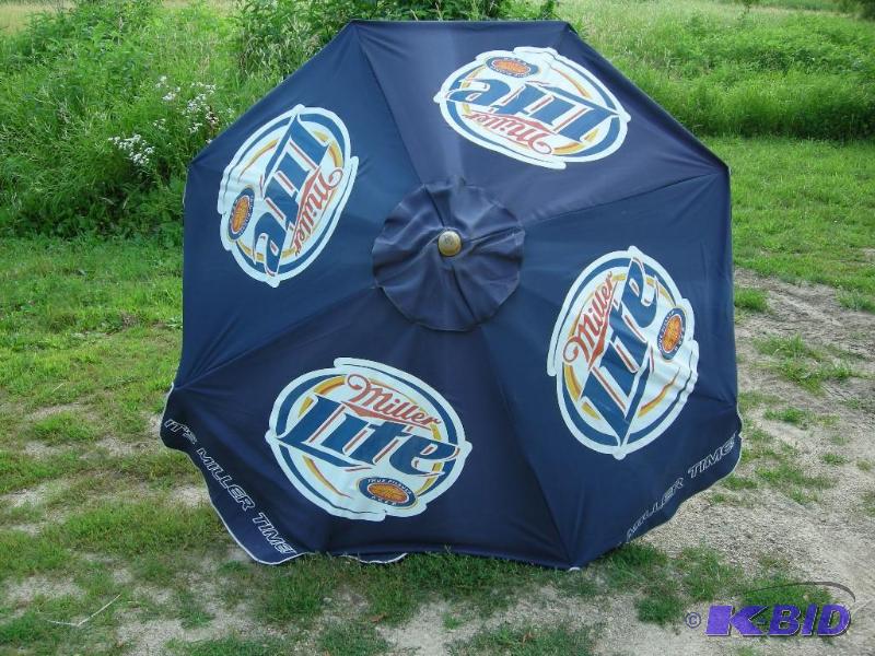 lot 686 image: Miller Lite patio table umbrella - used