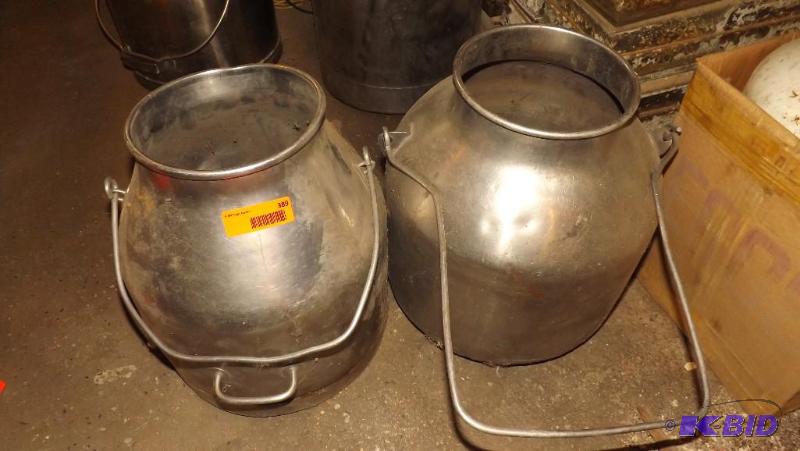 lot 389 image: Two Milk Cans, they have dents...