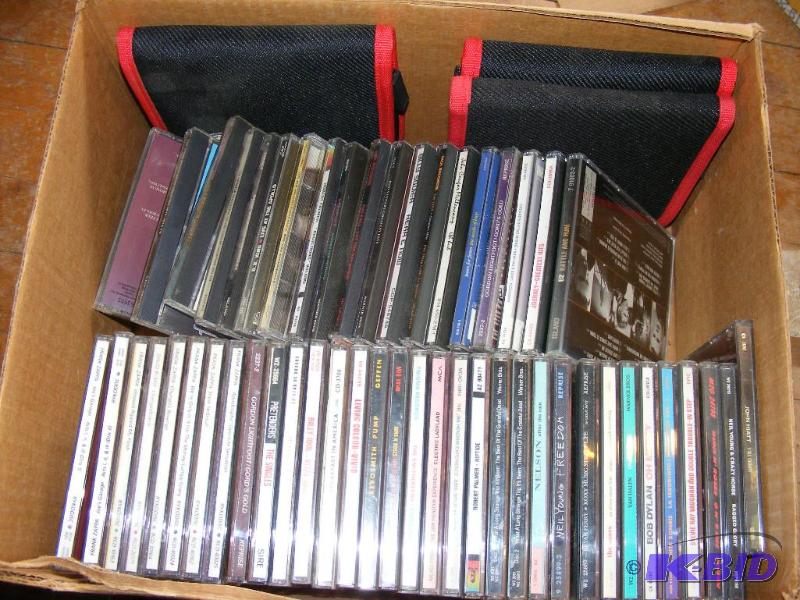 lot 93 image: Box of CDs and three carry cases...