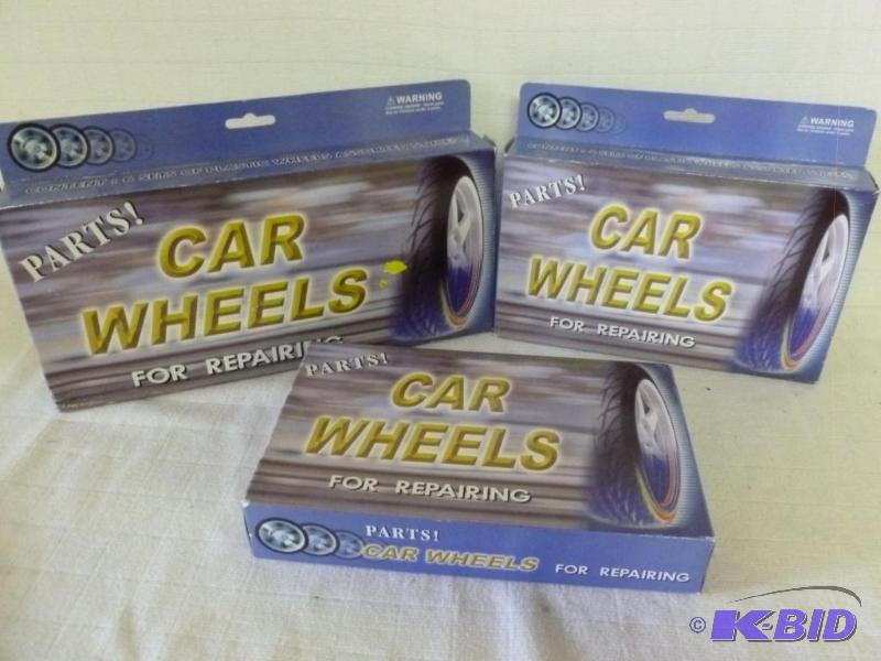 lot 165 image: Lot of three car wheels for repairing kits, a...
