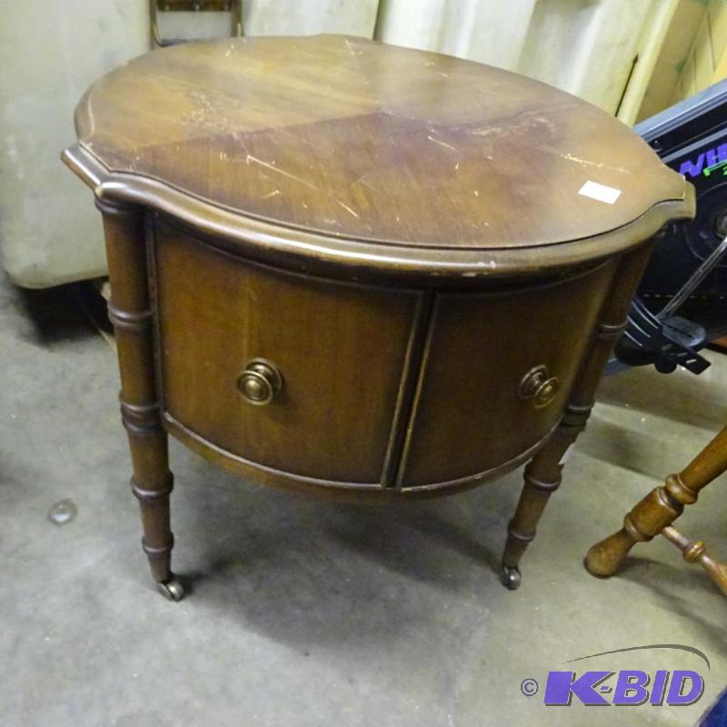 lot 110 image: Vinatge wood end table with 2 doors. On wheel...