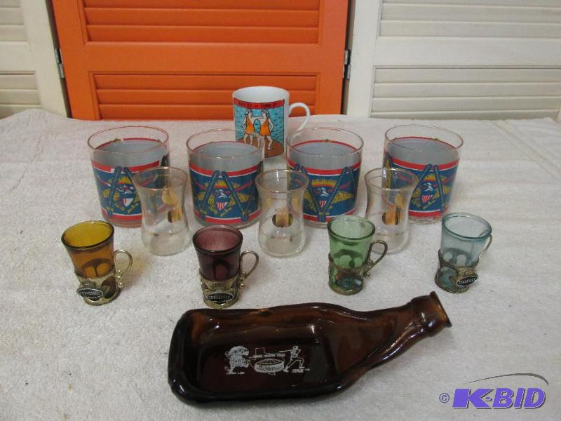 Shot Glasses, High Ball Glasses, A Coffee Cup and a Flat Beer Bottle.