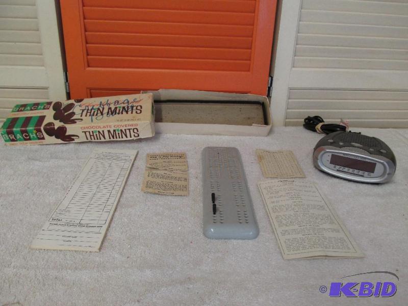 Old Cribbage Board and a Clock Radio.