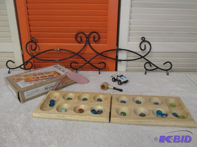 Cup Hanger, Toy Truck, Plastic Comb, Cob Pipe and a Mancala Game.
