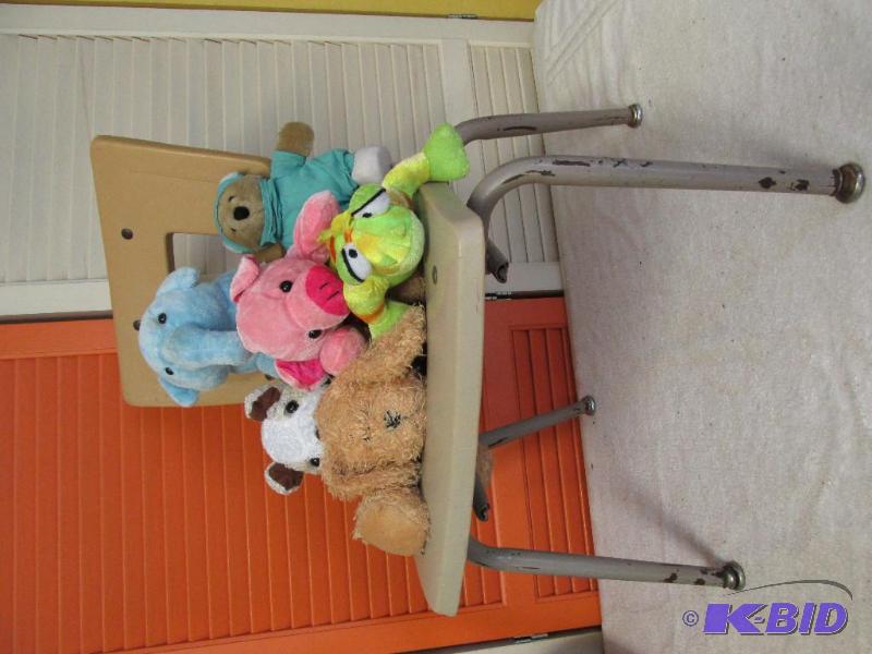 A Youths Chair and a Group of Stuffies.
