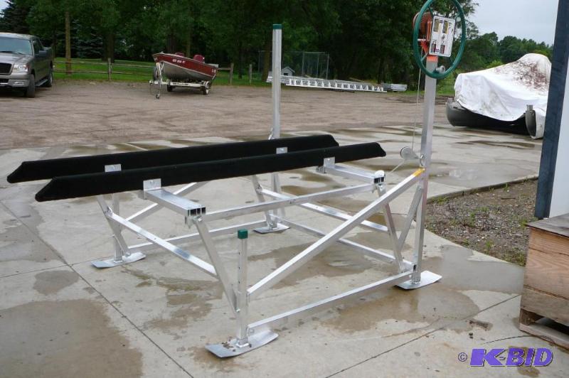 lot 3 image: Shoreline aluminum PWC lift with carpeted bun...
