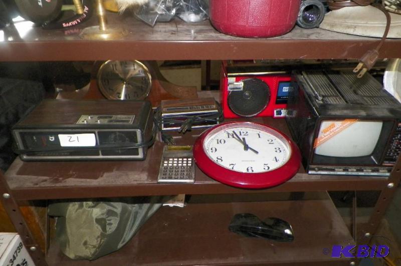 lot 21 image: Shelf Full Of Clocks & Radios