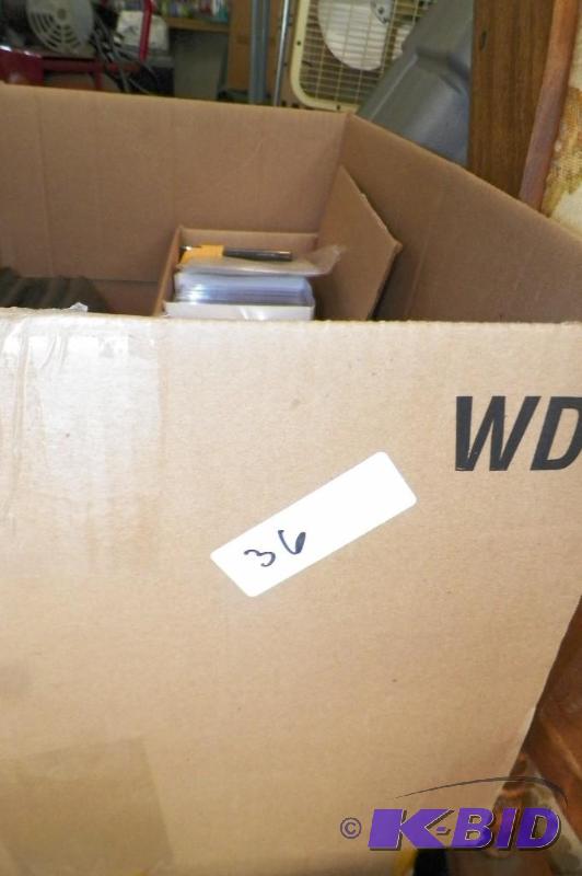 lot 36 image: Box of DVDs, CDs, Some Empty Cases
