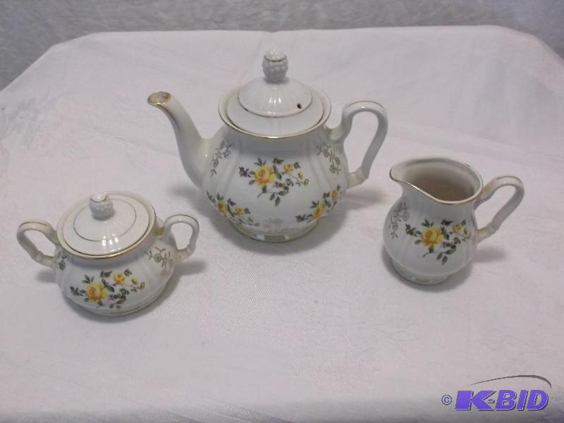 Cute tea pot with cream &amp sugar dishes al...