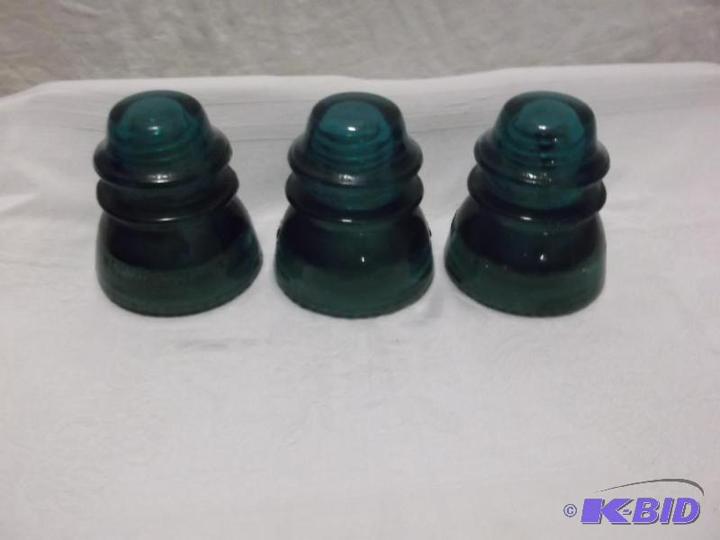 Vintage large glass insulators measuring 3 3...