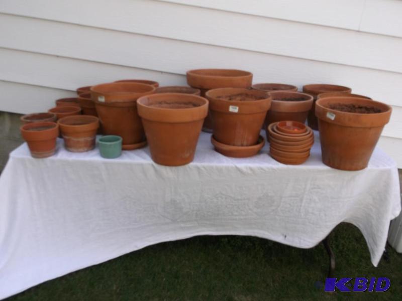 Large lot of 19 clay flower pots with water p...