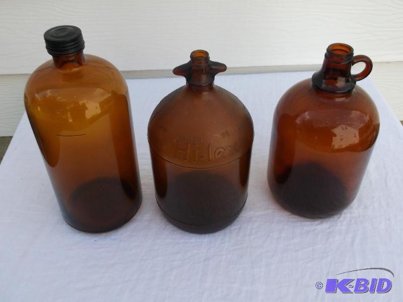 Vintage one gallon jugs one is Hi-lex all app...