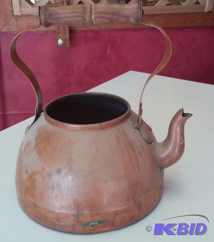 lot 9 image: Copper Tea Pot used as a flower pot...