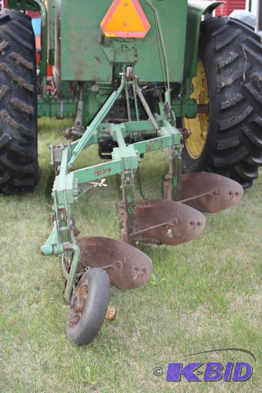 lot 5 image: John Deere model 810 3 x 14&quot plow...
