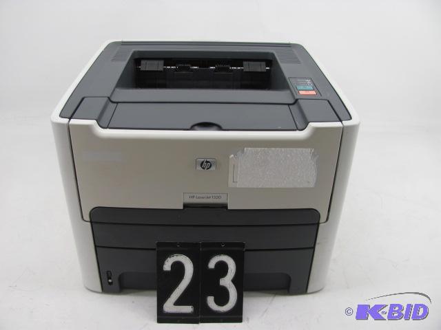 lot 23 image: HP laserjet 13230 printer. This unit has prin...