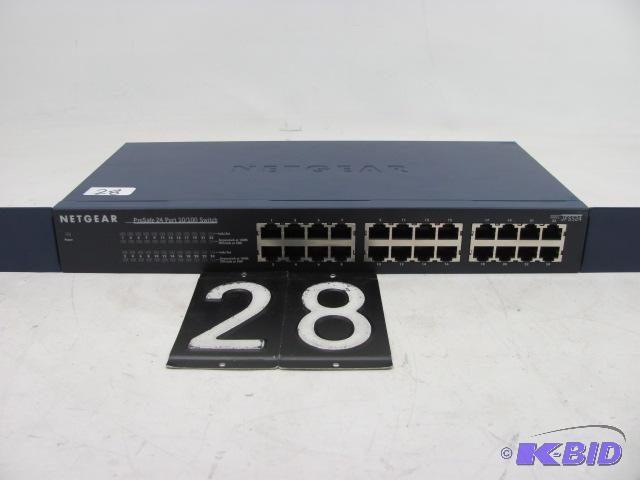 lot 28 image: Netgear LFS524 24 port network switch. This u...