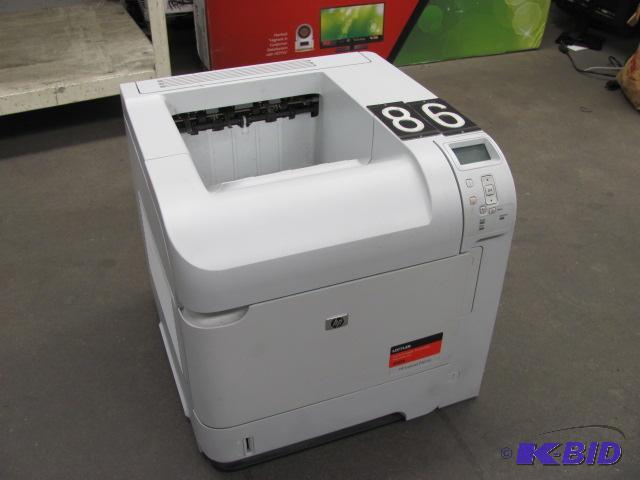 lot 86 image: HP laserjet p4014n printer. This unit is test...
