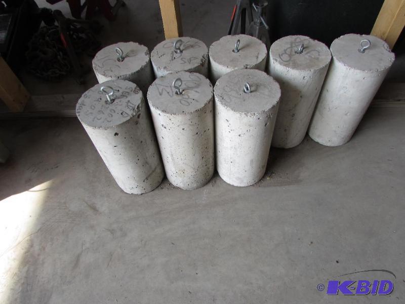 8 concrete cylinders and misc pavers