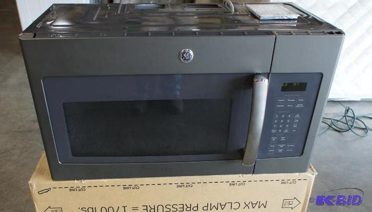 lot 9 image: New in Box GE over-the-range microwave. MSRP ...