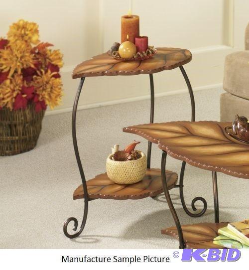 lot 63 image: Leaf End Table - Leaf-shaped top and shelf ha...