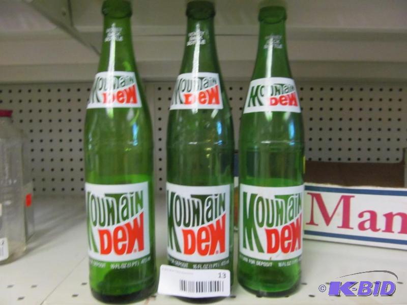 lot 13 image: Lot of 4 Vintage Mountain Dew Bottles