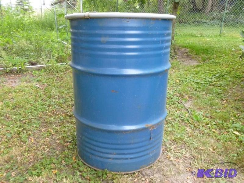 lot 15 image: Large 55 gallon steel drum with lid, was fill...