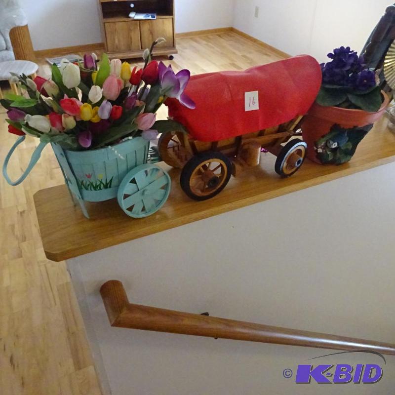 wood covered wagon. 2 flower arrangements...
