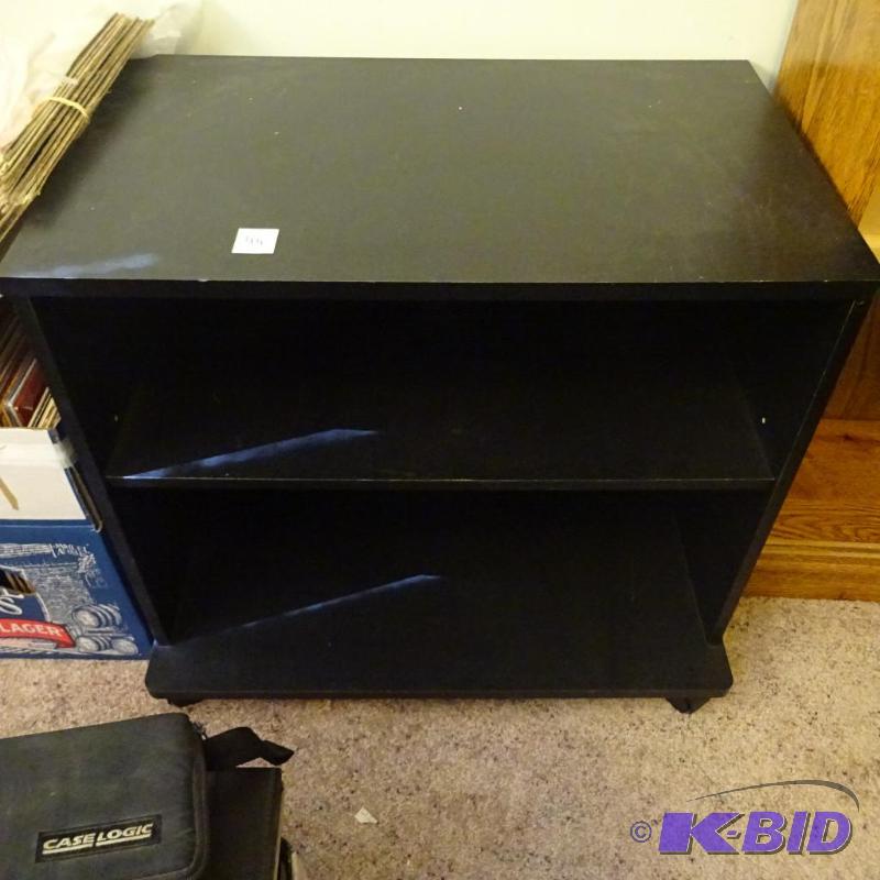 laminate tv stand on wheels. 24x15x21...