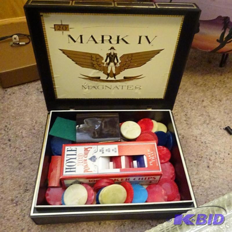 poker chips in a vintage Mark IV magnates cig...