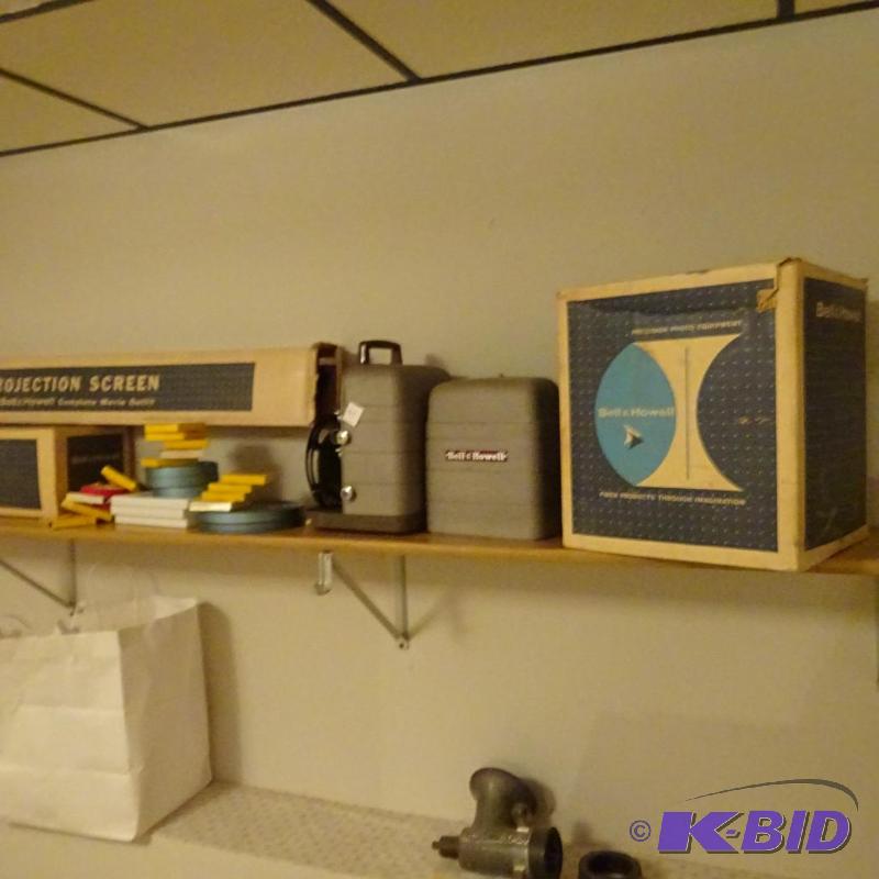 Bell and Howell 35mm projector. Misc reels. S...