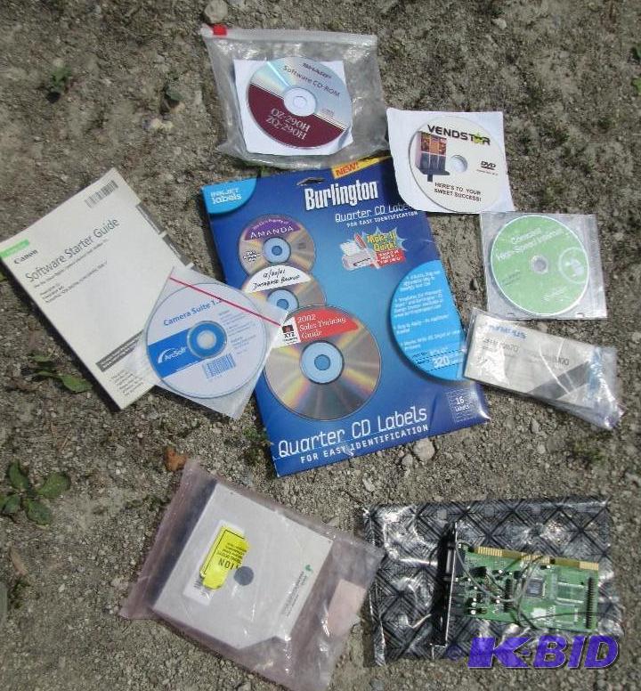 lot of mixed computer components and CD lable...