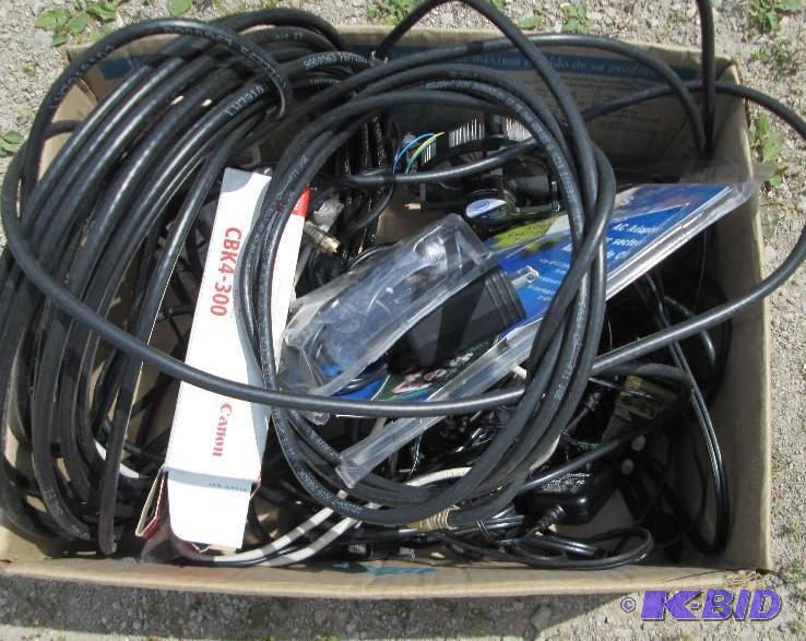lot of mixed cords, chargers, and small cooli...