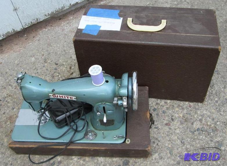 white brand antique sewing machine...