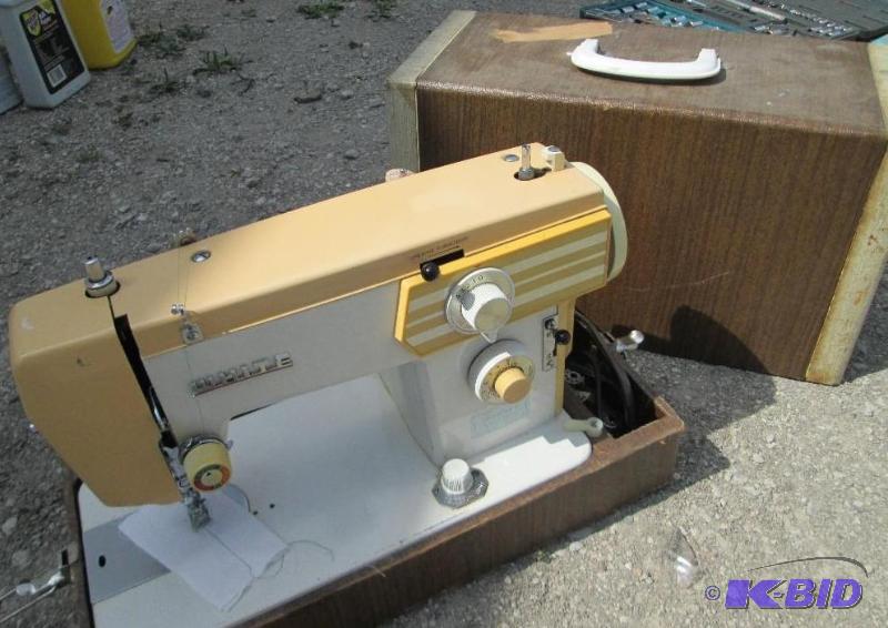 white brand antique sewing machine...