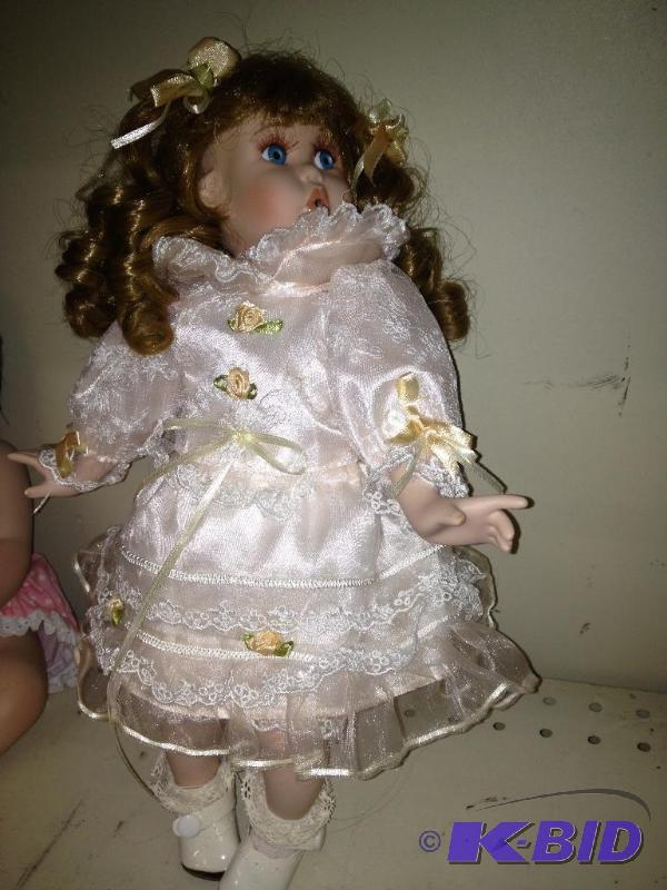 lot 83 image: Porcelain Doll  Excellent condition...