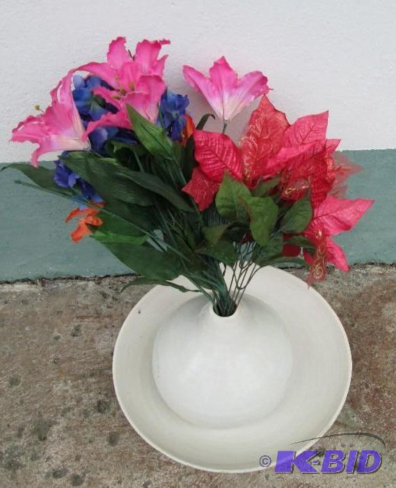 large vase in a bowl with decorative flowers...