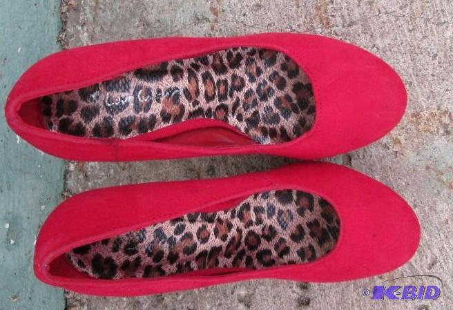 pair of bright red steleto shoes, with sparkl...
