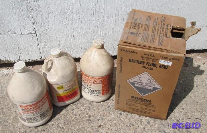 Partial bottles of Muriatic acid and battery ...