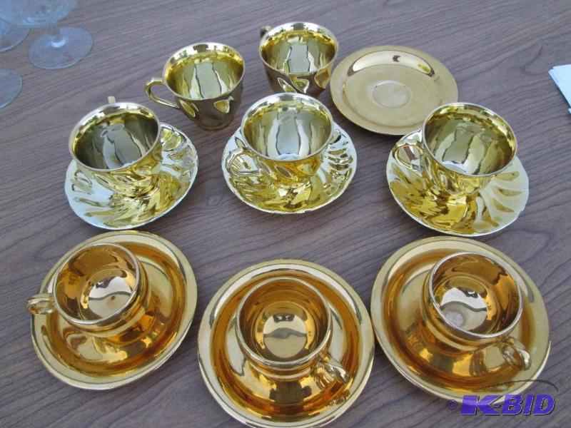 lot 142 image: Gold colored espresso and tea set,...