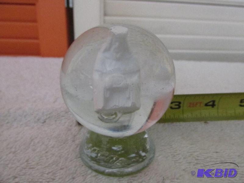 lot 22 image: Glass Sphere with one of the Three Wise Men (I believe)