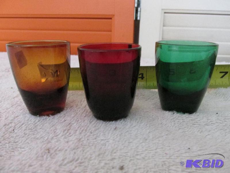 lot 24 image: Three Colored Shot Glasses.
