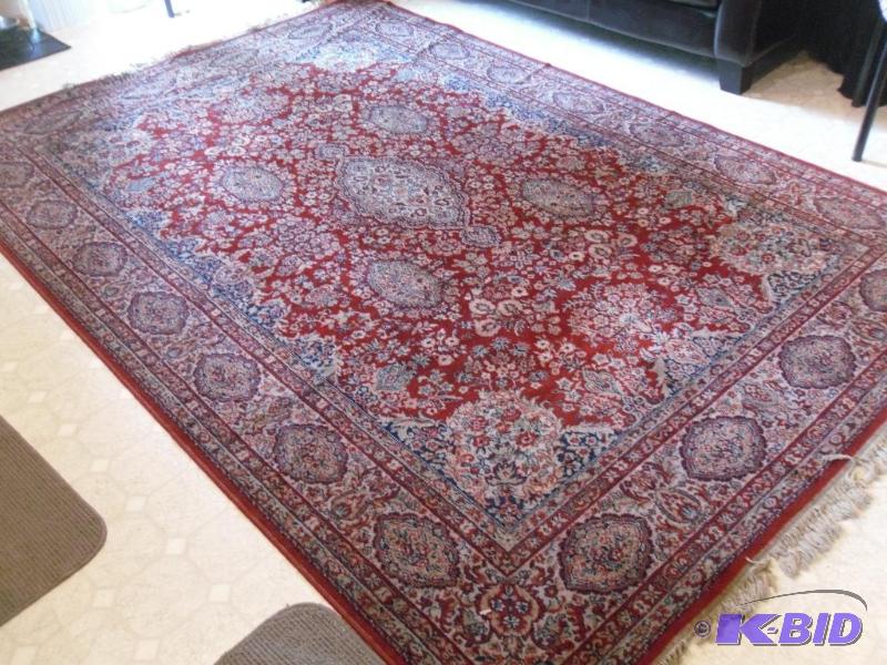 lot 126 image: Large 10 ft x 6.5 ft Area Rug. Just needs min...