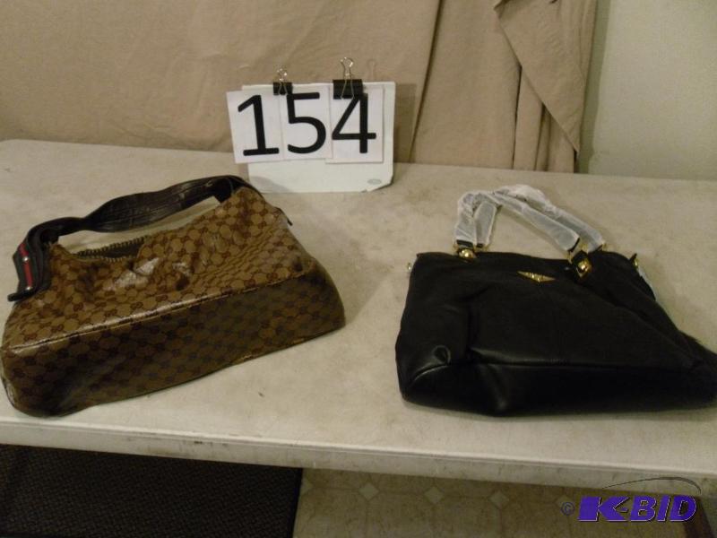 lot 154 image: New Black Purse Marked Prade and Purse&nbspM...