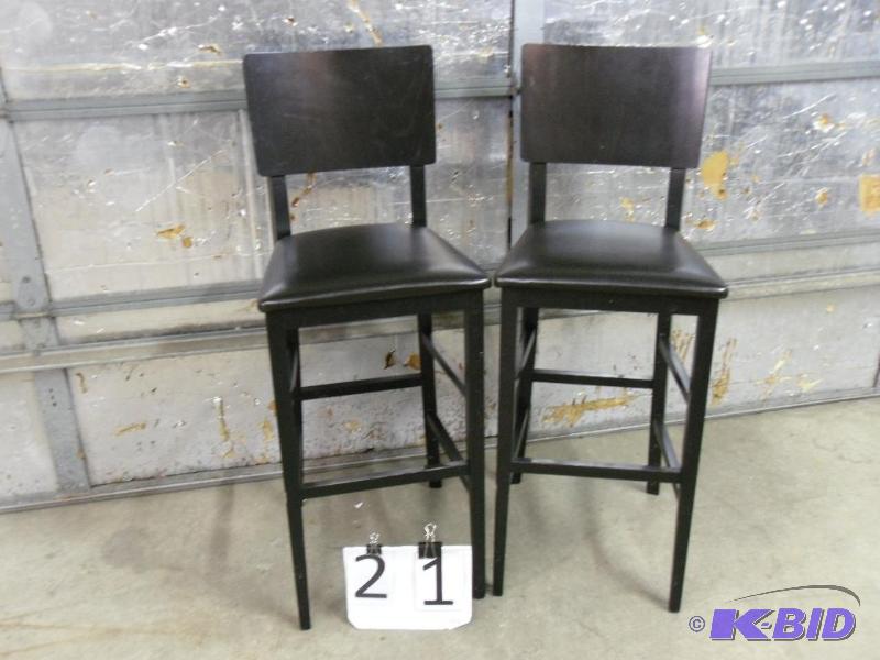 lot 21 image: Lot of 2 Bar Stools. Wood with leather seats....