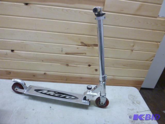 lot 124 image: Huffy Micro Fold-Up Scooter...