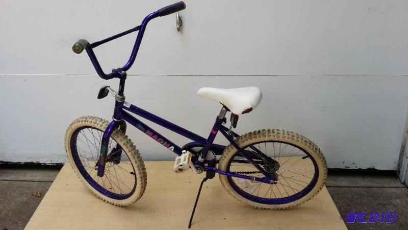 lot 11 image: Girls 12" Magna bike, seat is worn, tire...