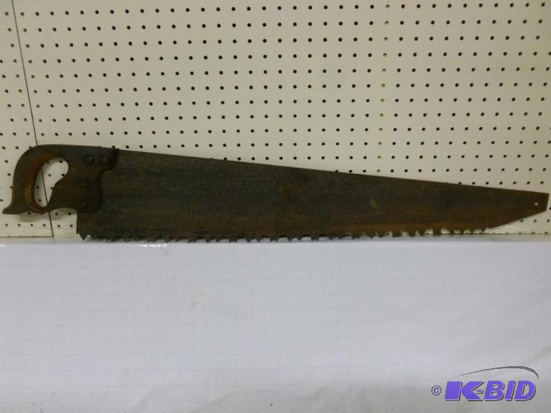 lot 10 image: Large antique wood handled ice saw that measu...